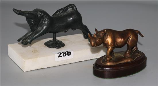 A bronze model of a rhinoceros and a bull